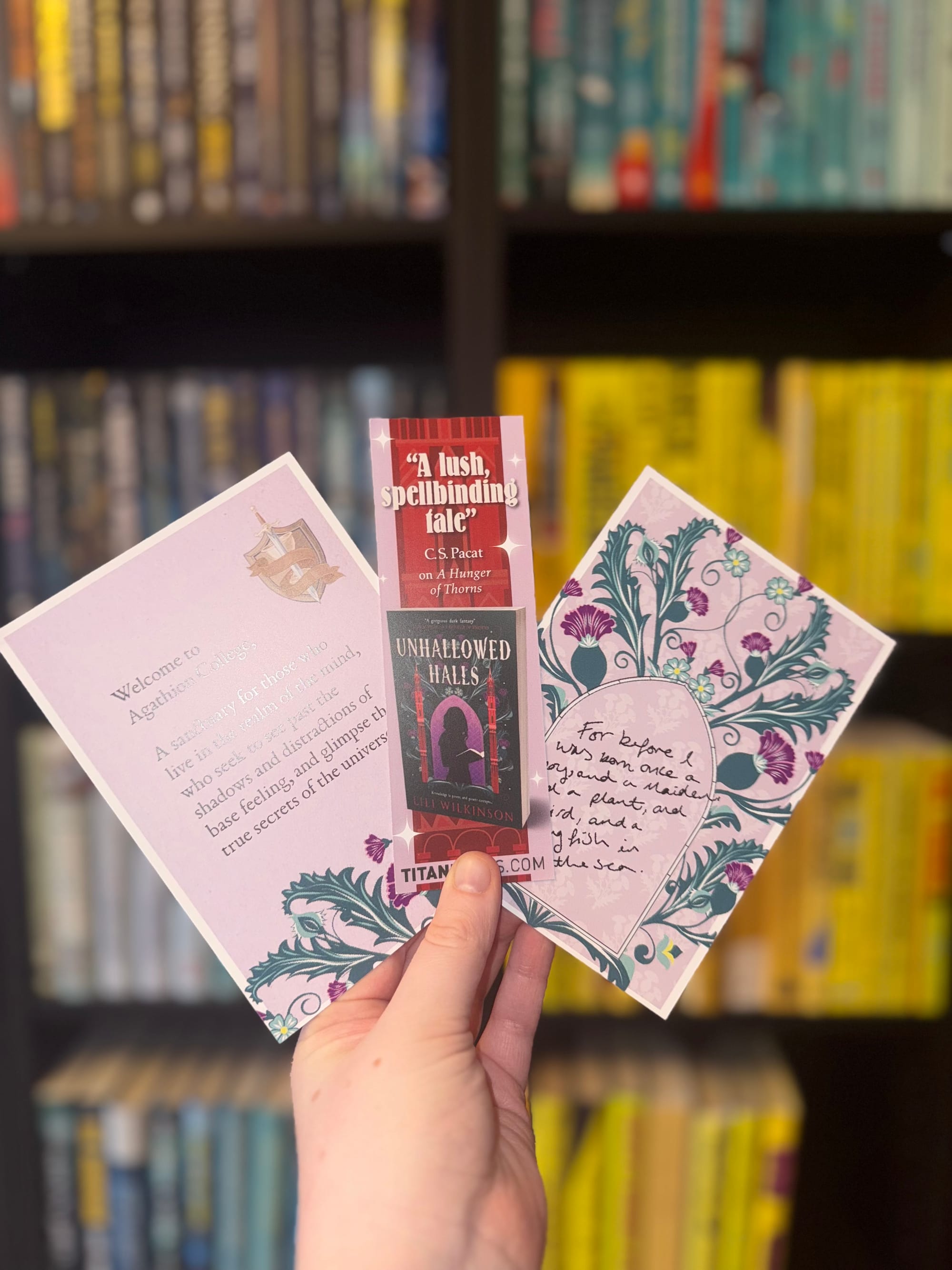 A hand holding promotional material. 