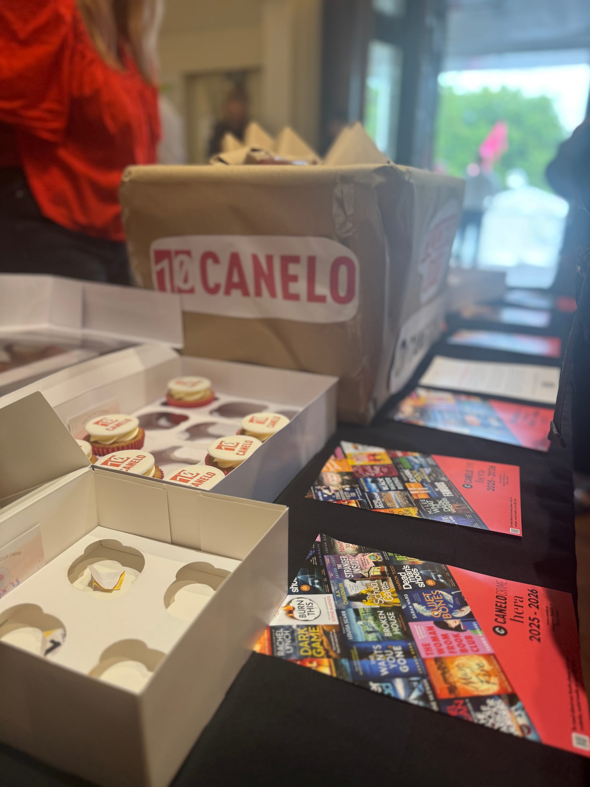 Canelo lucky dip box with cup cakes next to it. 